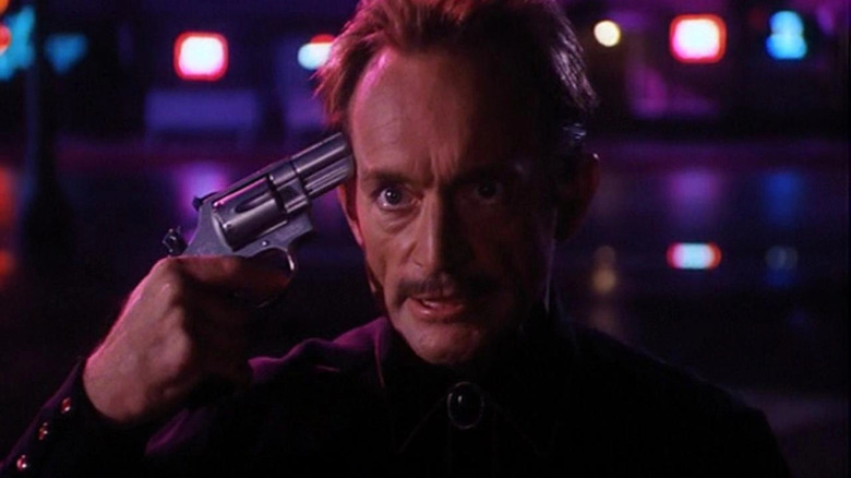 Reno holds a revolver to his head in Cutting Cards
