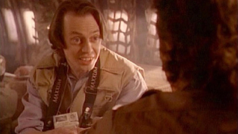Isaac speaks eagerly with Dalton in Tales from the Crypt