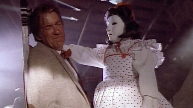 Dr. Goetz winces while confronting Felicity in Tales from the Crypt