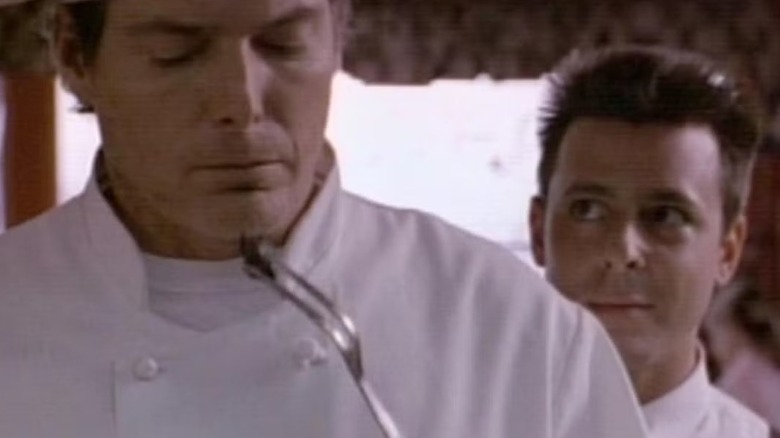 Gaston watches Fred sample his meat in Tales from the Crypt