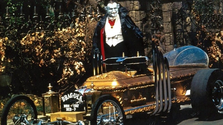 Grandpa (Al Lewis) stands by the Dragula in The Munsters