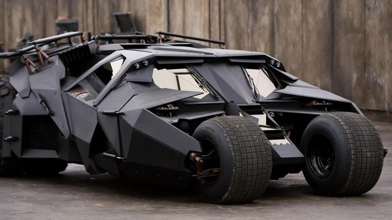 The Tumbler sits in a garage in The Dark Knight