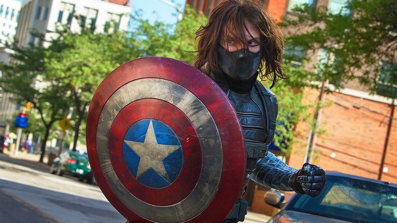 Winter Soldier (Sebastian Stan) holding Cap's shield in Captain America: The Winter Soldier