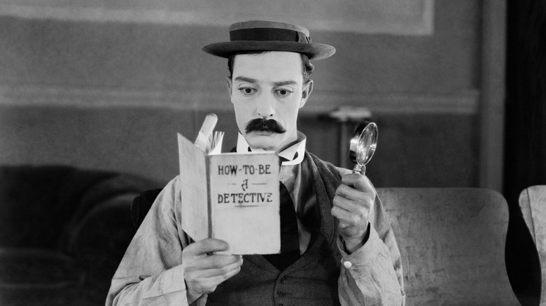 Keaton reading detective book