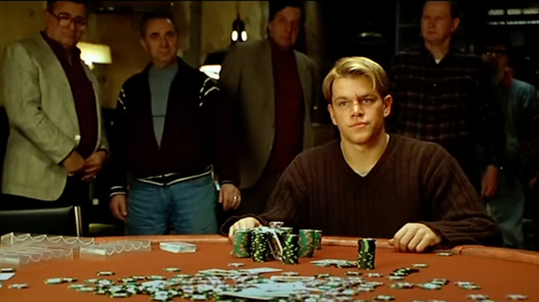 Matt Damon as Mike McDermott sits behind his winnings in Rounders