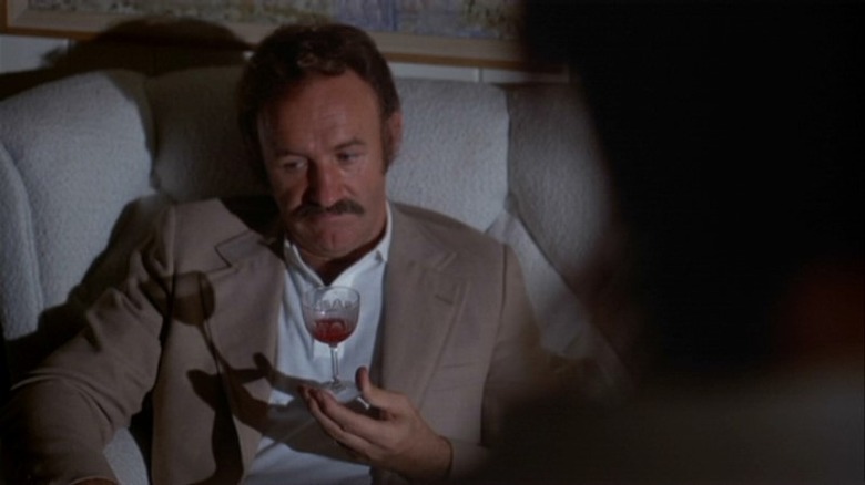 Gene Hackman drinking alone