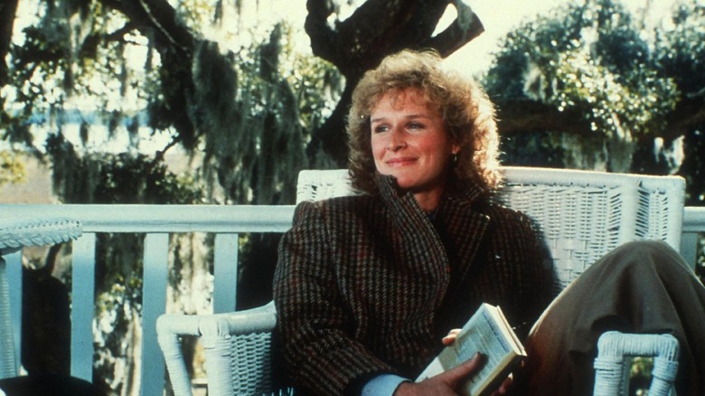 Glenn Close as Sarah Cooper in "The Big Chill" sits on porch reading