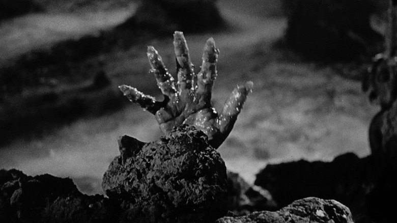 a witch's hand, rising from the grave in Black Sunday
