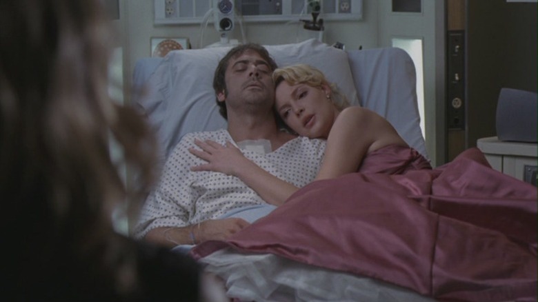 Katherine Heigl as Dr. Izzie Stevens in a pink prom dress holding on to Jeffrey Dean Morgan as the dead body of Denny Duquette on Grey's Anatomy