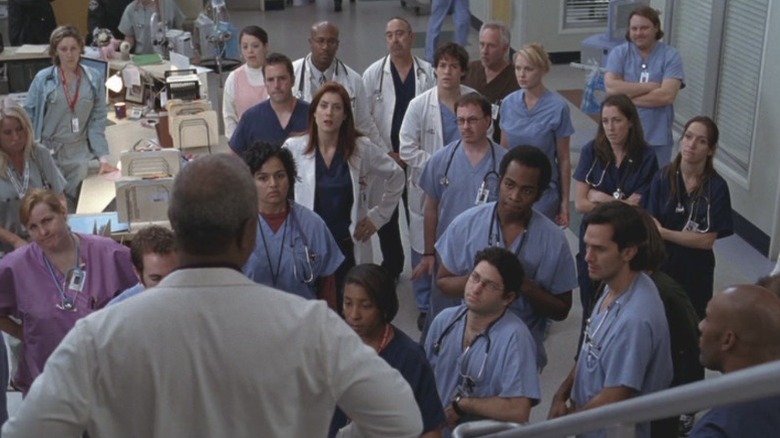 The Seattle Grace Hospital staff listening to an address from James Pickens Jr. as Dr. Richard Webber on Grey's Anatomy