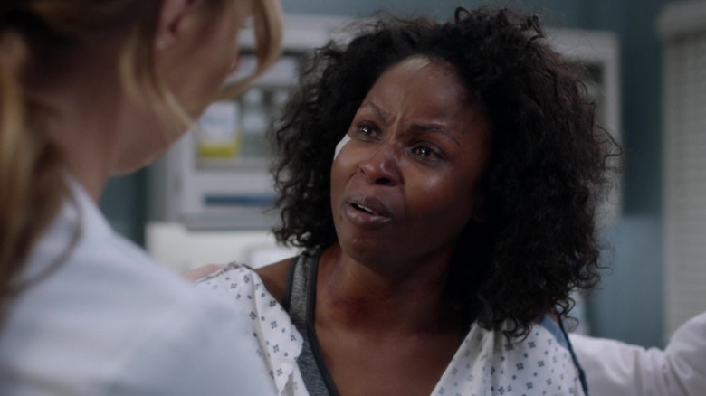 Khalilah Joi as Abby talking through tears to Camila Luddington as Jo Karev on Grey's Anatomy