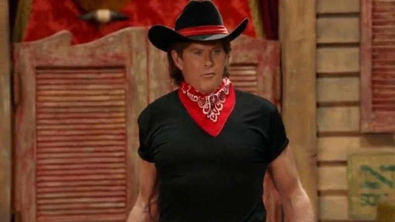 David Hasselhoff wears a cowboy costume in front of a saloon set on Young Sheldon