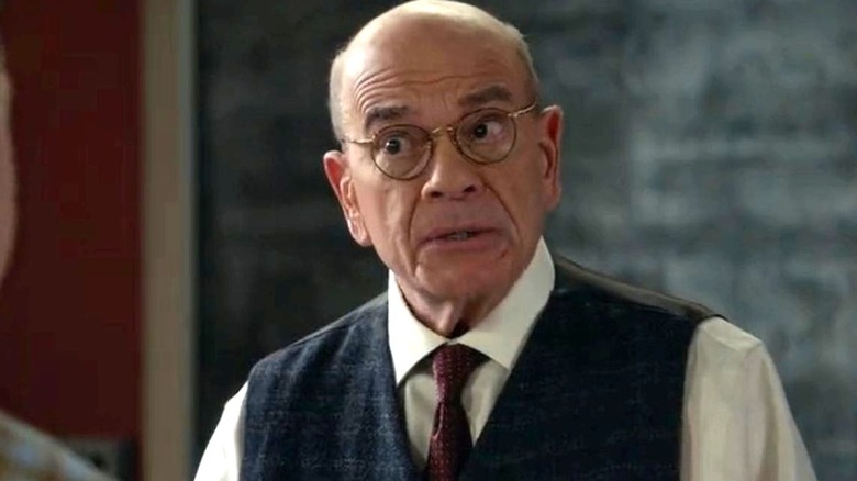 Robert Picardo as Professor Salzman stands in front of a chalkboard on Young Sheldon