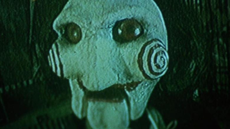 Saw puppet with swirly cheeks