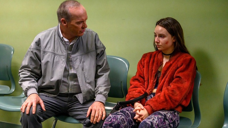 Michael Keaton as Dr. Samuel Finnix sits next to Alayna Hester as Elizabeth Ann on Dopesick