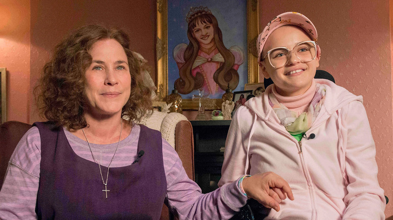 Patricia Arquette as Dee Dee Blanchard sits next to Joey King as Gypsy Blanchard on The Act
