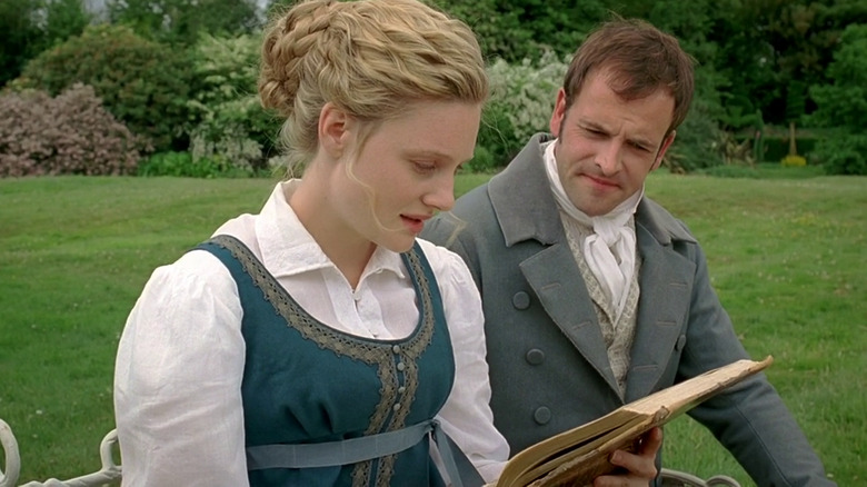 Romola Garai and Jonny Lee Miller in "Emma" reading book