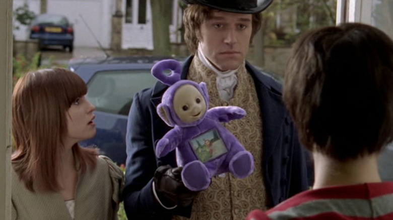Jemima Hooper and Elliot Cowan in "Lost in Austen" play with Teletubby