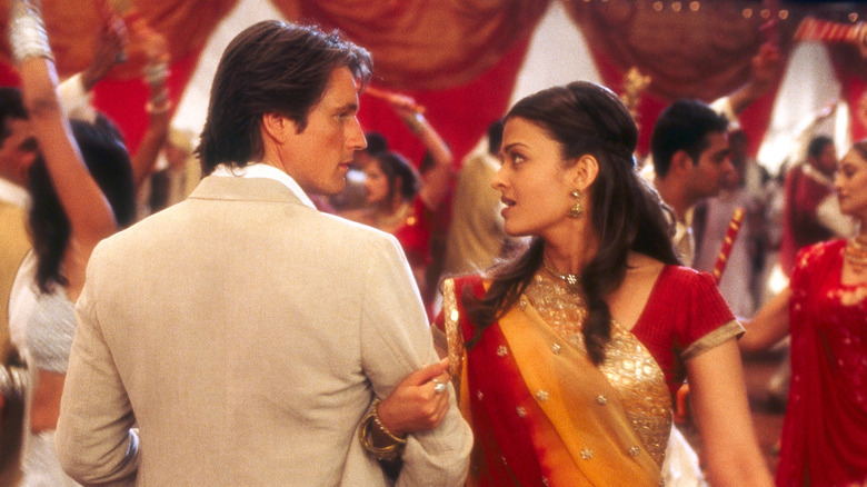 Darcy (Martin Henderson) and Lalita (Aishwarya Rai Bachchan) dance and gaze at each other at a party in Bride and Prejudice