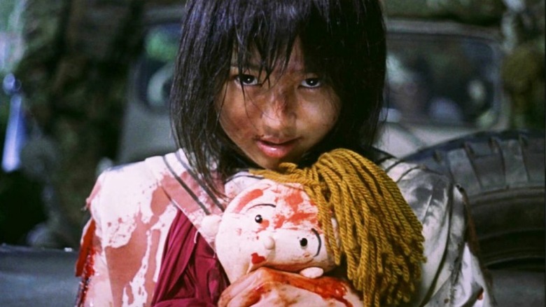 battle royale girl hugs bloody doll