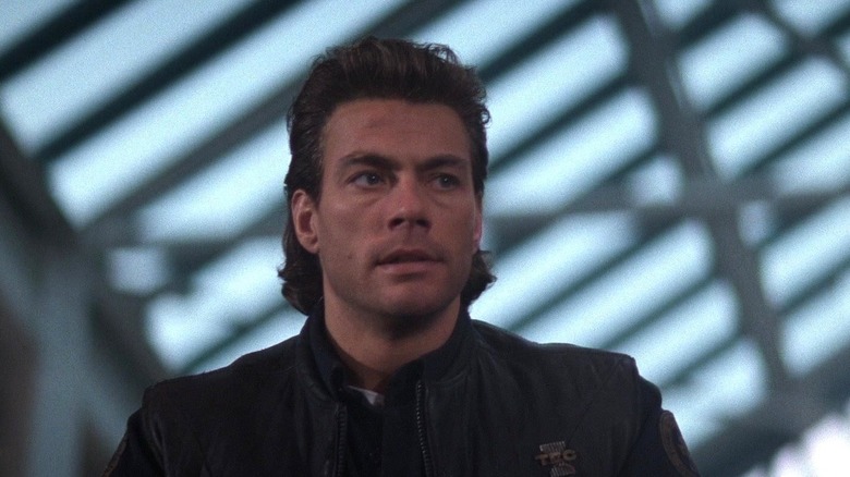 Jean-Claude Van Damme's Max Walker looking to the side in Timecop