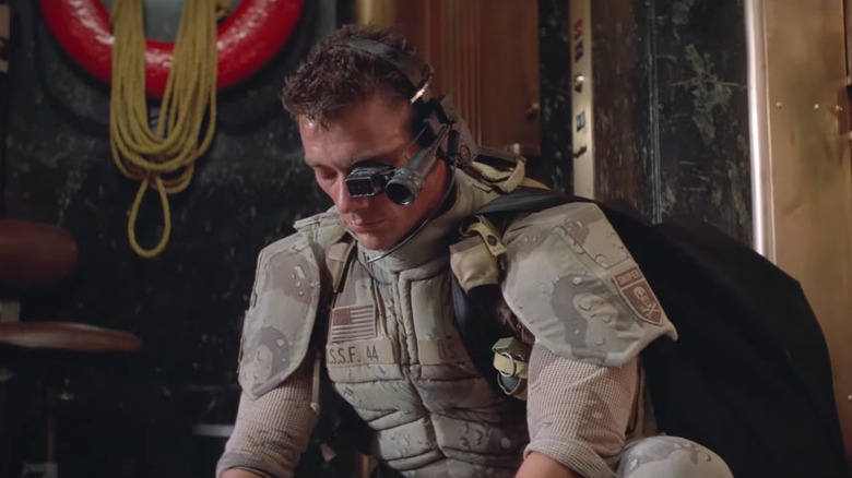 Jean-Claude Van Damme's Luc Deveraux looking down in Universal Soldier
