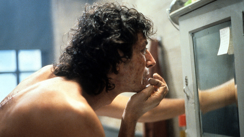 the fly cronenberg goldblum transforming