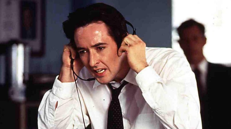 Cusack yells on headset