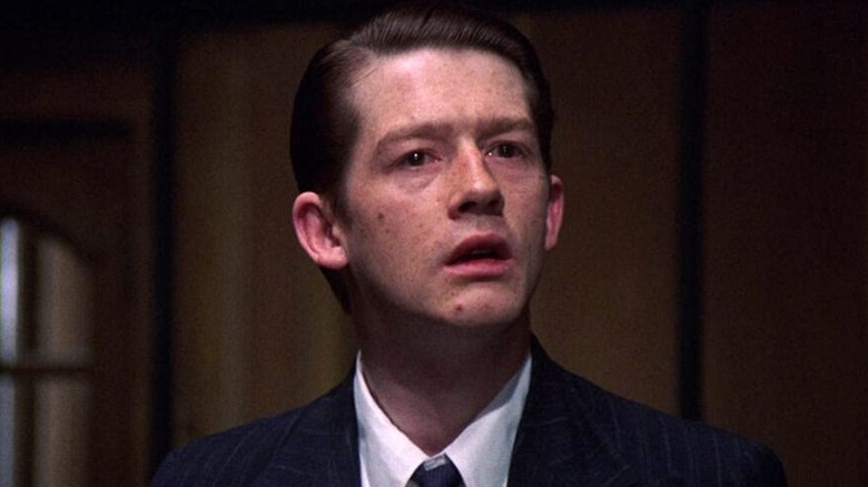 Young John Hurt suit