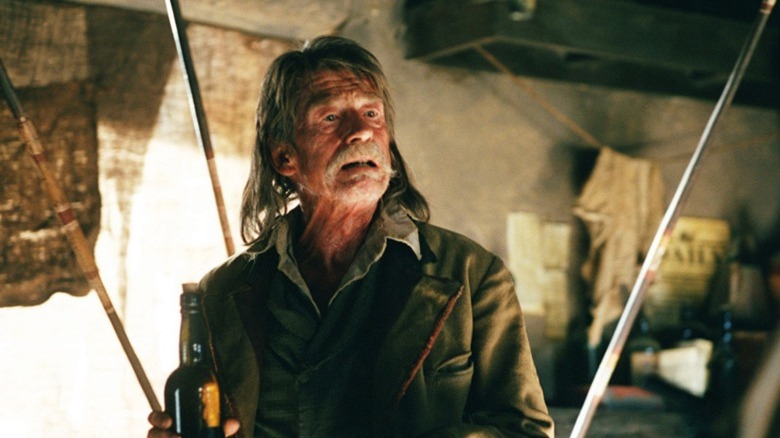 John Hurt long hair bottle