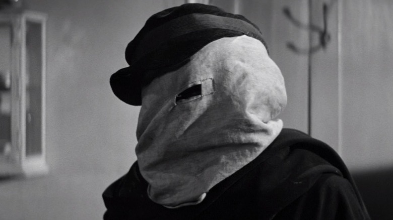 Man with bag on head
