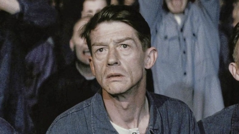 concerned man in overalls