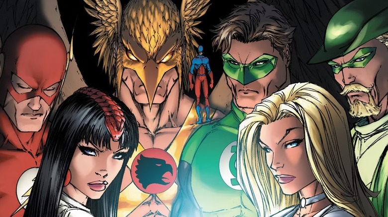 The Justice League glances up ominously from a glowing light on the cover to Identity Crisis #2
