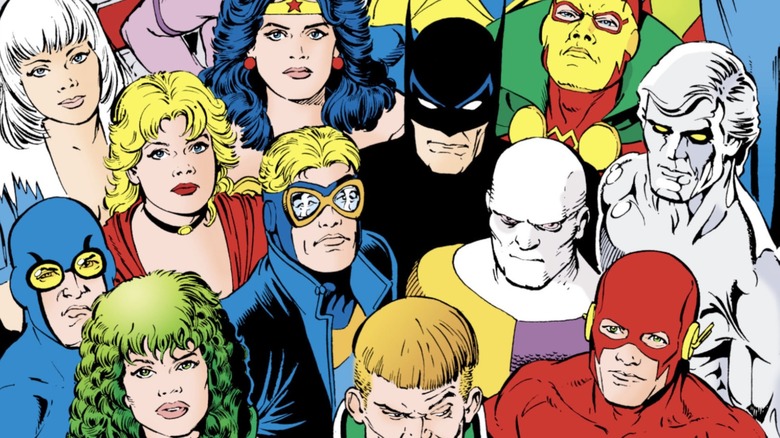 The Justice League International stands close together and looks up on the cover of Justice League International (vol. 1) #24