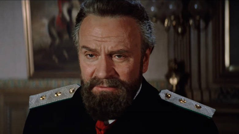 Olivier in military uniform looking upset