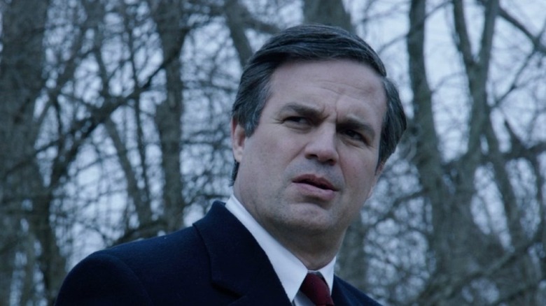 Robert Bilott (Mark Ruffalo) stands looking incredulously in the woods in Dark Waters (2019)