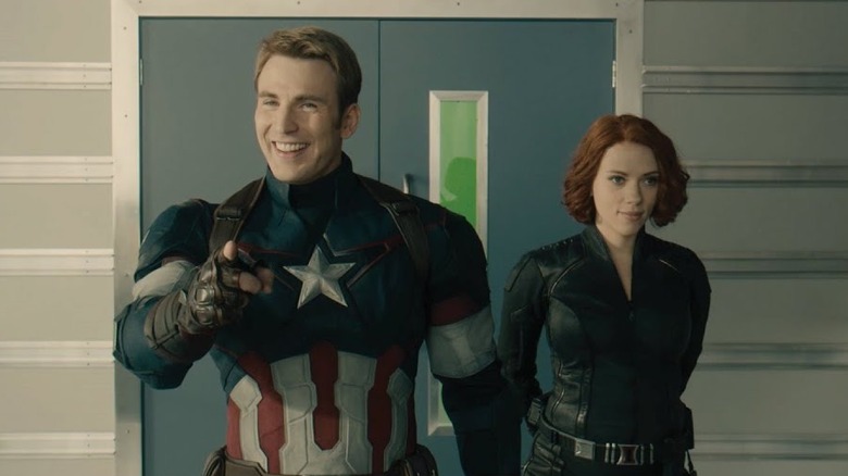 Chris Evans and Scarlett Johansson smiling while filming Avengers Age of Ultron