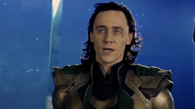 Tom Hiddleston as Loki on a blue screen behind-the-scenes of The Avengers