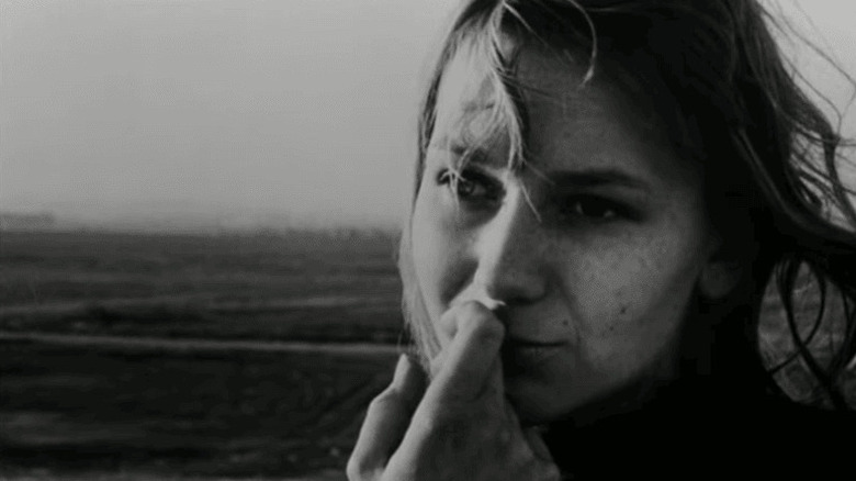 The Woman (Hélène Châtelain) with hand to her mouth in La Jetee