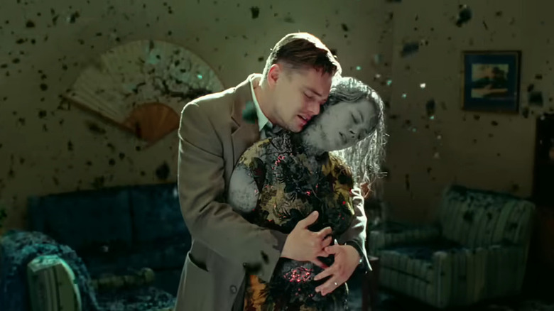 Andrew (Leonardo DiCaprio) hugging wife as she turns to ash in Shutter Island