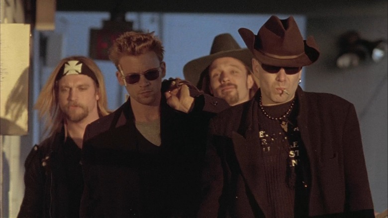 A group of men walk towards the camera in mockumentary Hard Core Logo