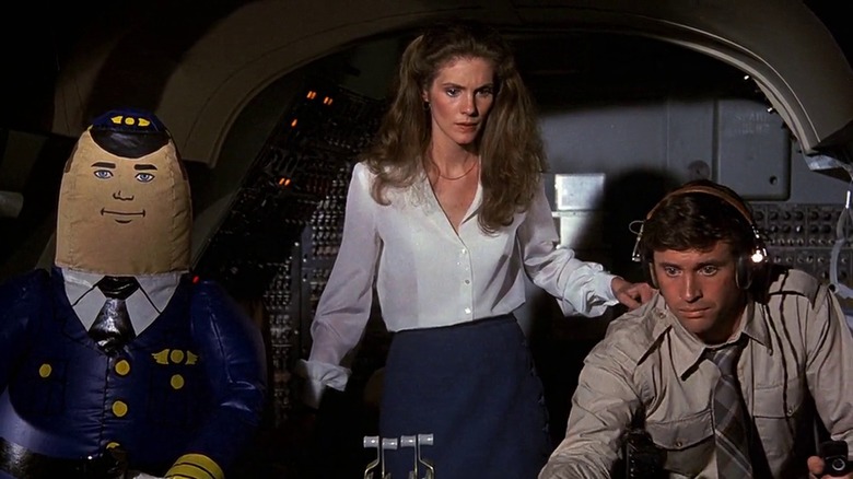 A blow-up pilot, Julie Hagerty as Elaine, and Robert Hays as Ted, at the airplane controls in Airplane!