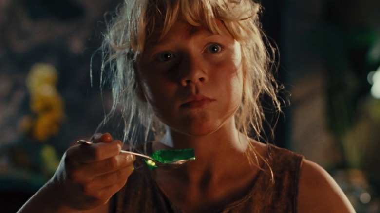 Ariana Richards as Lex in Jurassic Park, holding jiggling green jello on a spoon