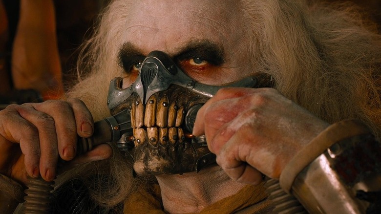 Hugh Keays-Byrne's Immortan Joe putting on his mask in Mad Max: Fury Road