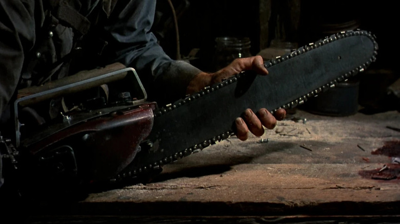 Bruce Campbell as Ash Williams showing off his chainsaw arm in Ash Versus the Evil Dead