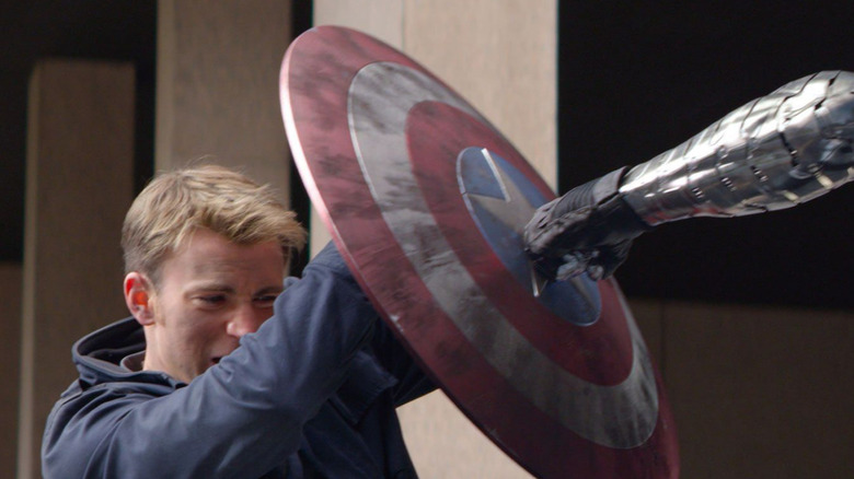 Chris Evans as Captain America blocking a punch by the Winter Soldier in Captain America: The Winter Soldier