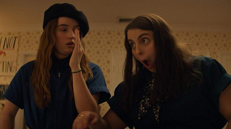 Molly (Beanie Feldstein) and Amy (Kaitlyn Dever) dance in a bedroom in Booksmart