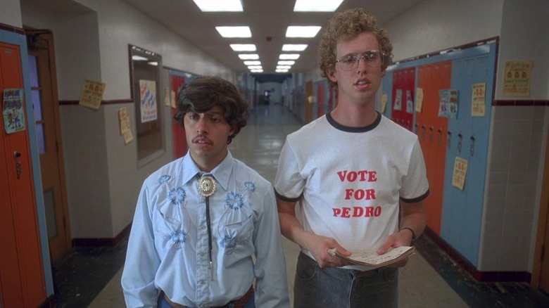 Efren Ramirez as Pedro and Jon Heder as Napoleon in his Vote for Pedro shirt, in the hallway in Napoleon Dynamite
