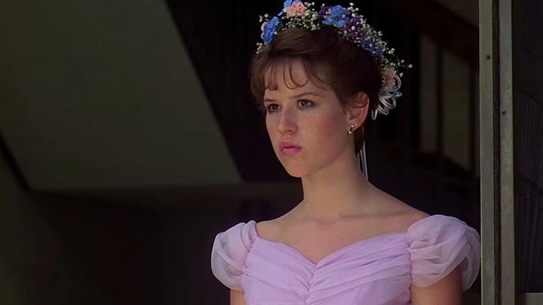 Molly Ringwald as Sam in a pink dress and flower crown, in Sixteen Candles
