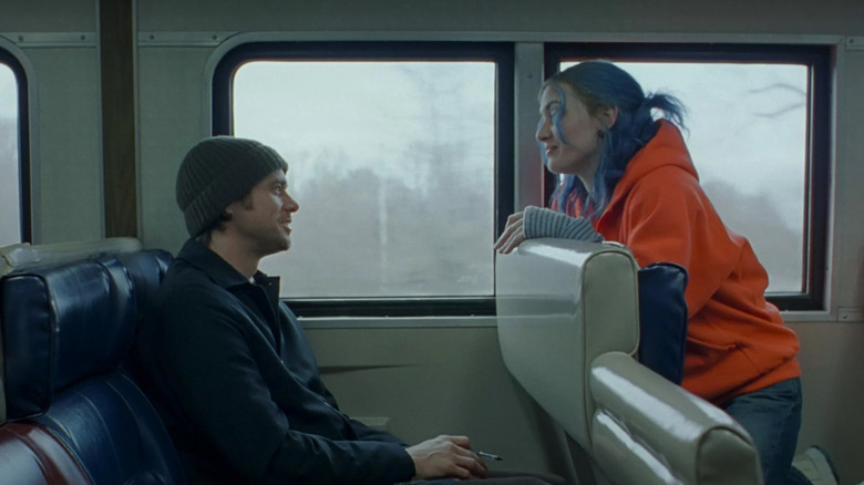 Clementine Kruczynski (Kate Winslet) talks to Joel Barish (Jim Carrey) on a train in Eternal Sunshine of the Spotless Mind